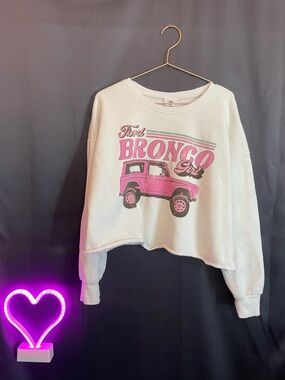 Women’s white Pullover Sweatshirt with Pink Bronco Graphic Ford cream bright